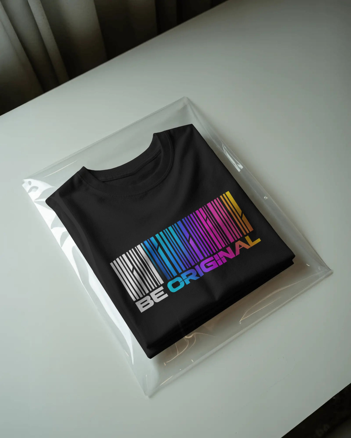 Black Be Original graphic t-shirt packaged