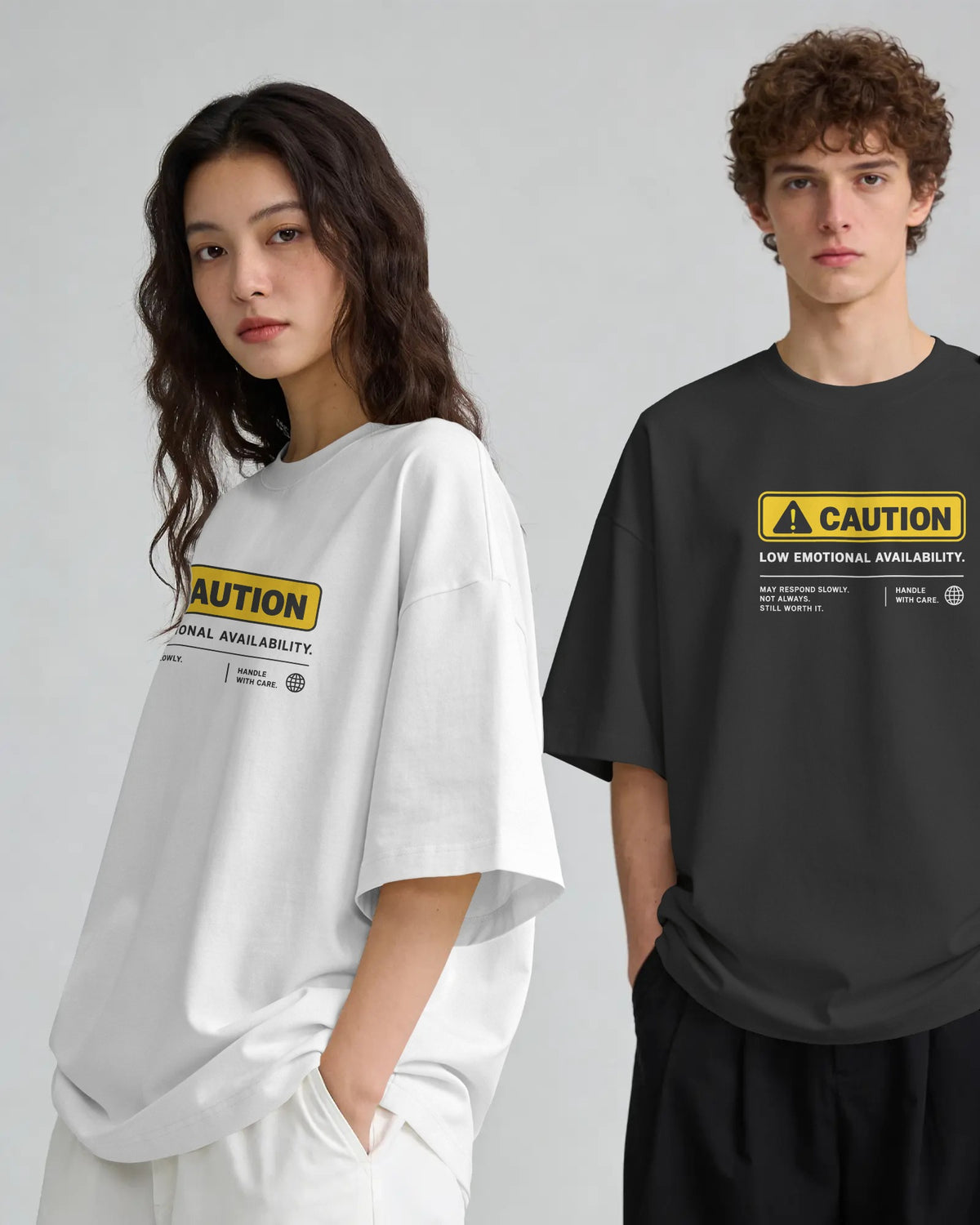 Black and white Caution graphic t-shirts on models