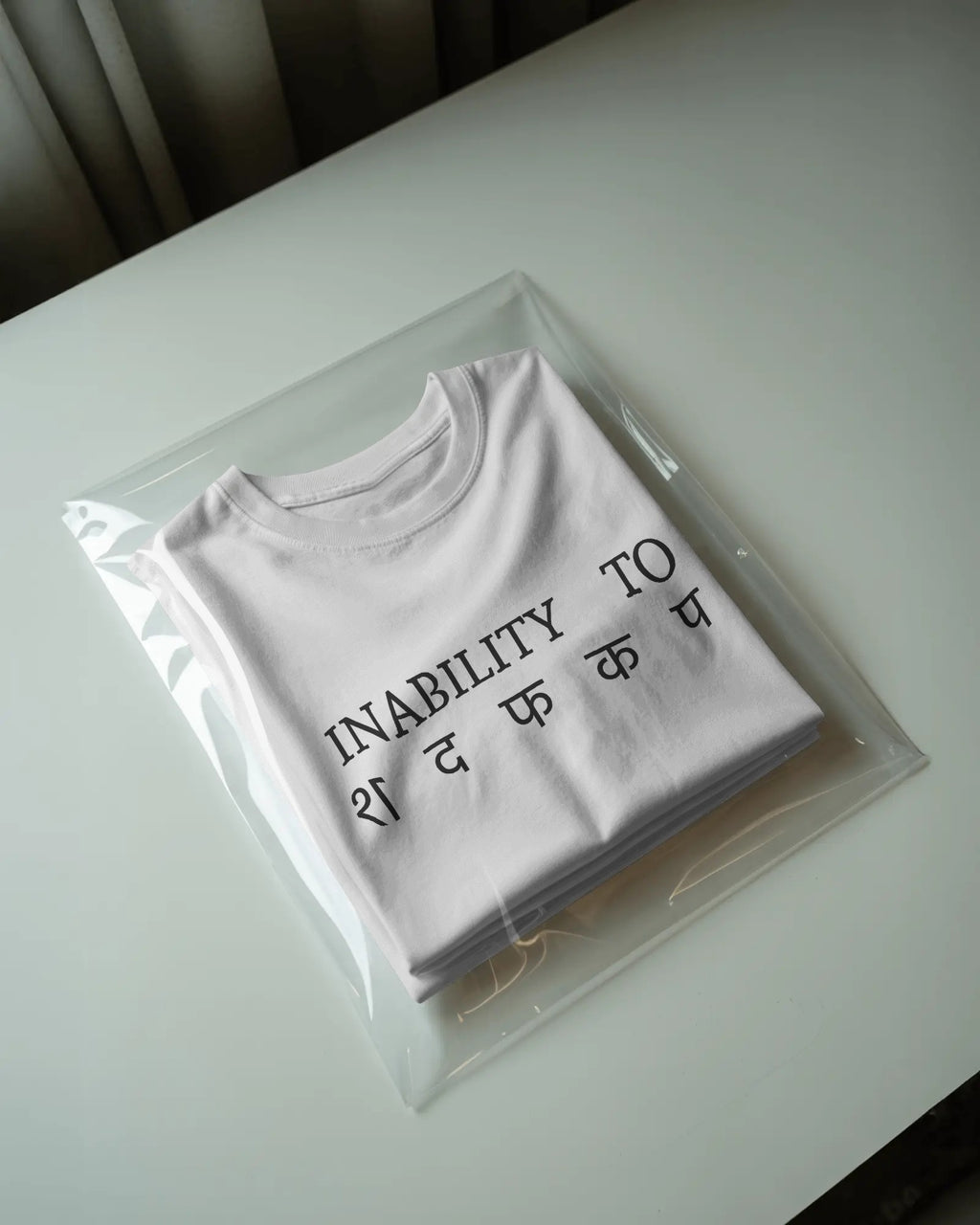 White STFU graphic t-shirt packaged
