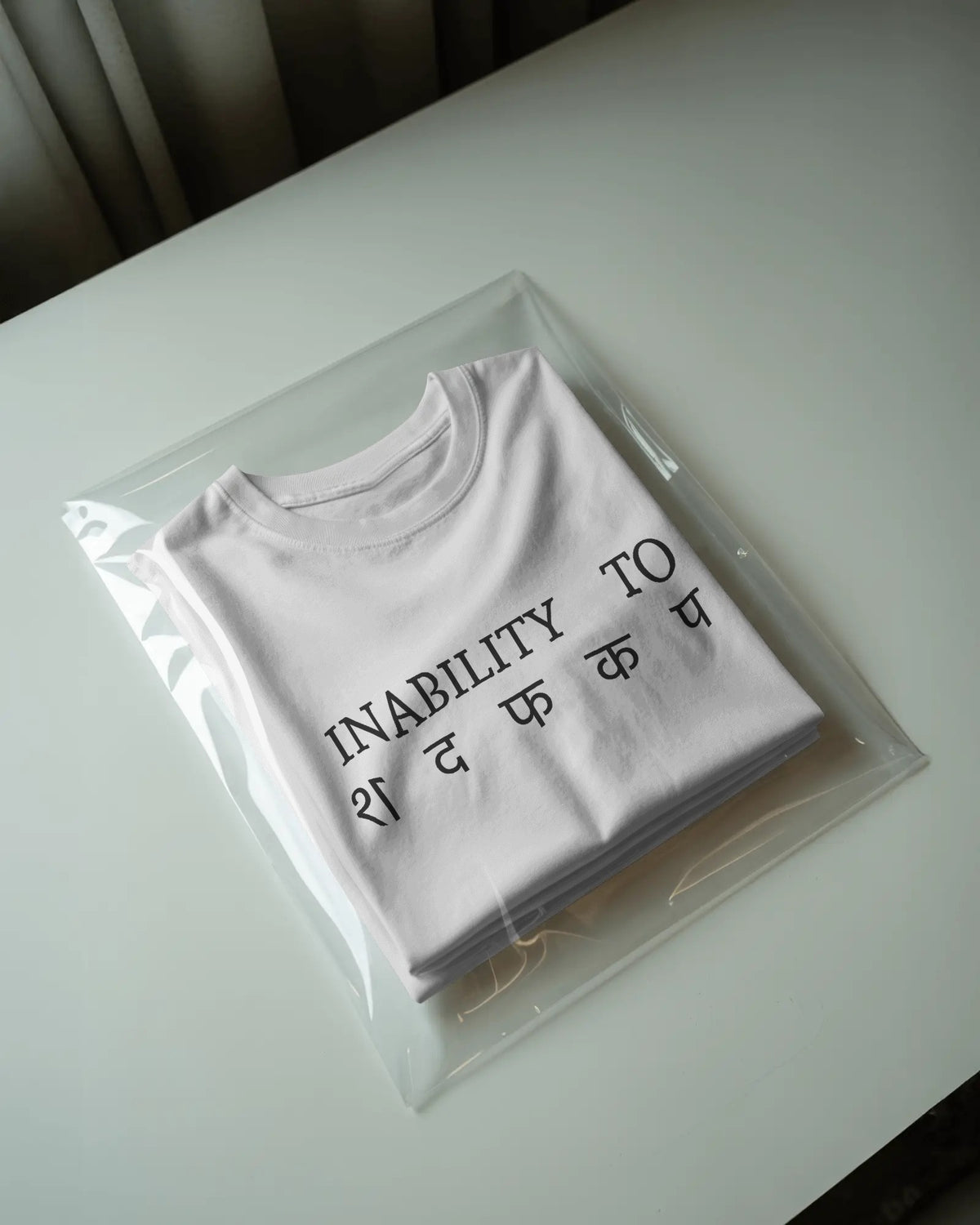 White STFU graphic t-shirt packaged