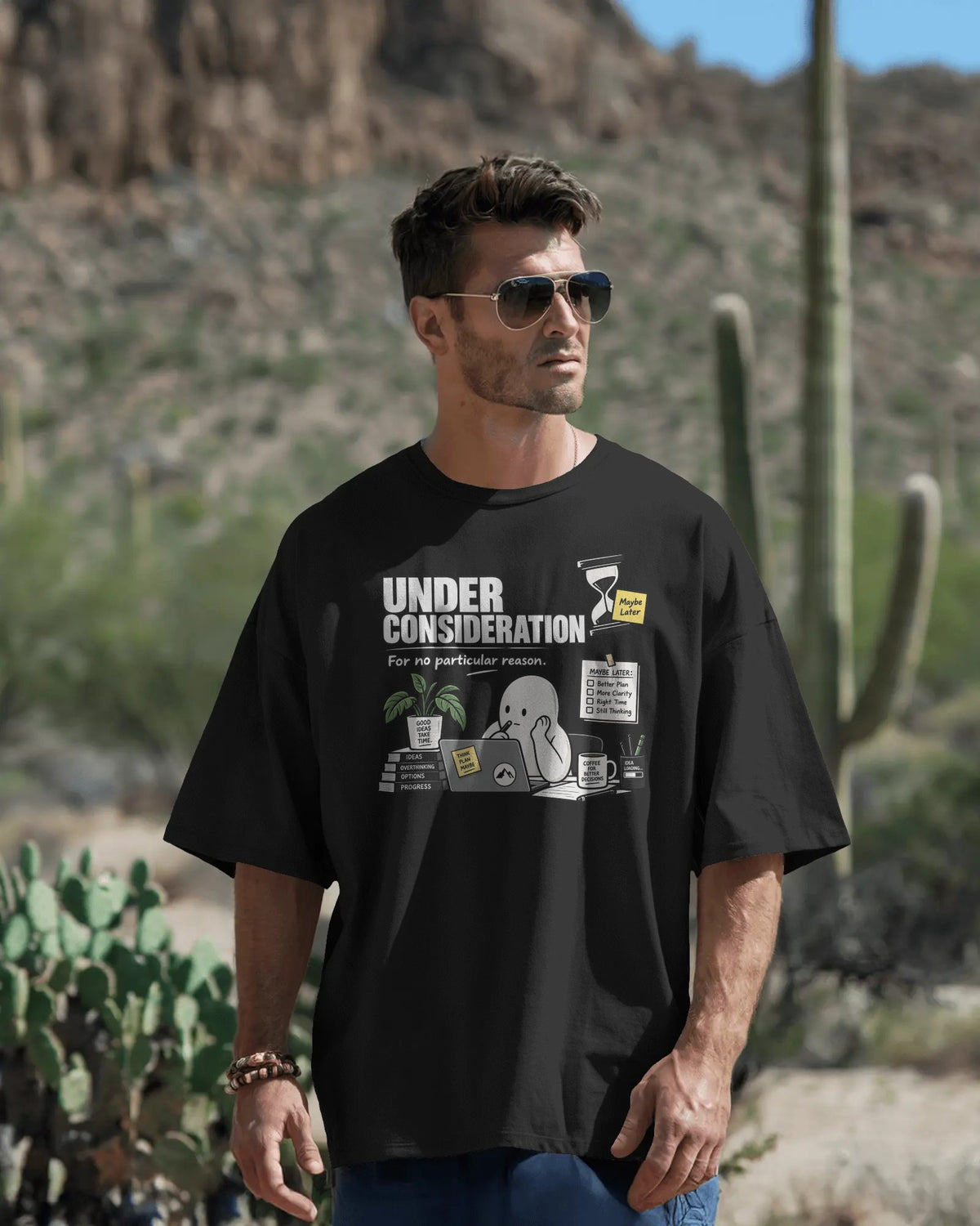 Black Under Consideration graphic t-shirt front model view